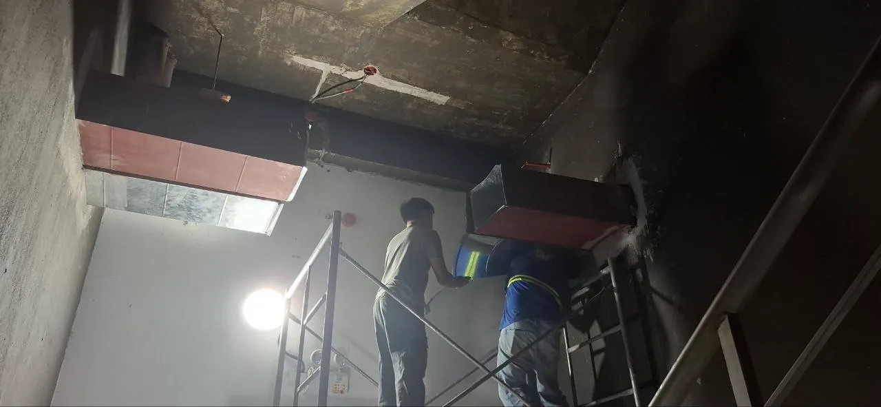 Technicians installing overhead ventilation ducting at Private Café City Hub in Baguio City