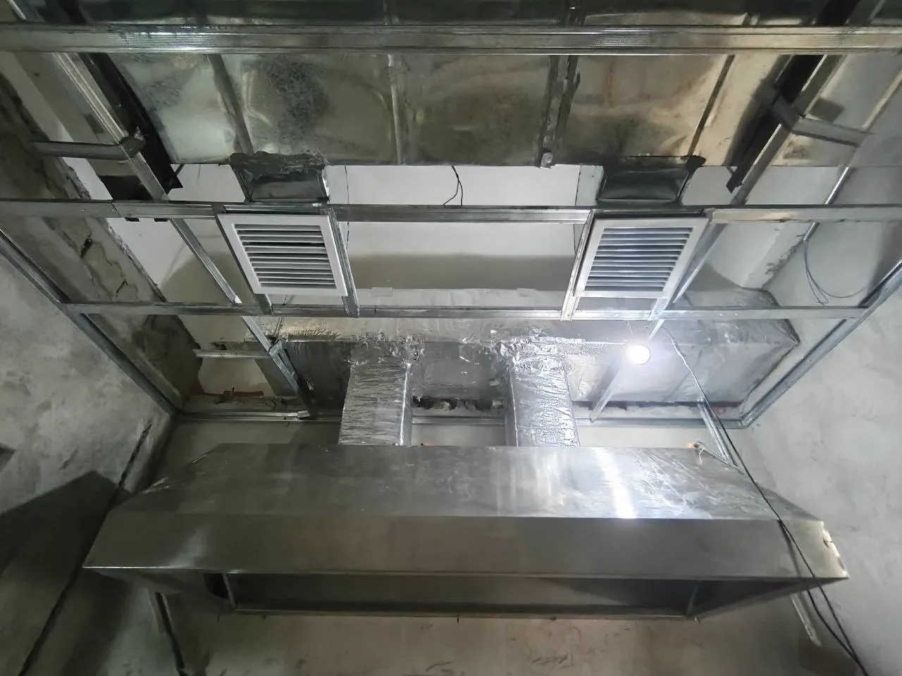 Stainless-steel kitchen hood and ventilation ducting at the convenience store in Ilagan, Isabela